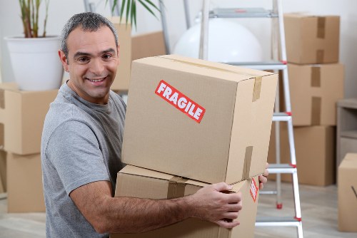 Removal van and moving crew in Arnosgrove residential street