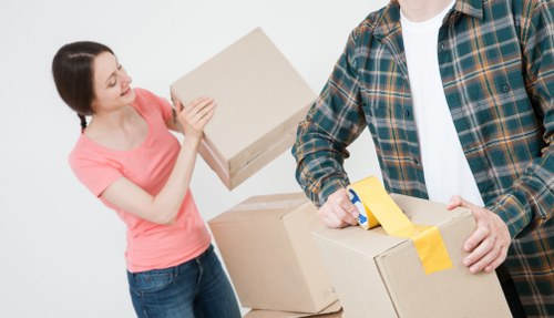 Furniture being carefully carried down stairs during a local move