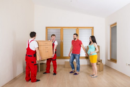 Furniture and boxes being loaded into a van for a local move