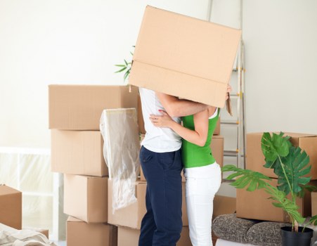 Packed office equipment and furniture ready for relocation