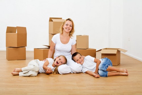 Loading furniture into a van for a home relocation in Arnos Grove