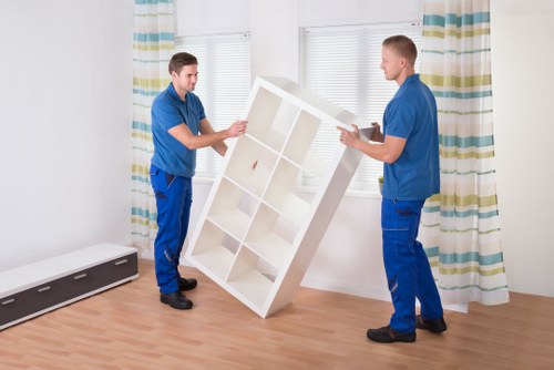 Local crew handling furniture removal in a North London street