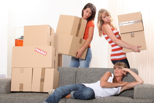 Furniture and household items being unloaded at a new home in Arnosgrove